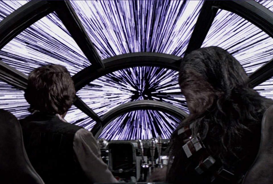 Han Solo and Chewbacca in the Millennium Falcon cockpit as it jumps to hyperspace